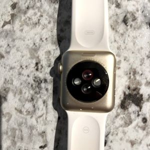 Series 2 Apple Watch with small white band. 44 mm.